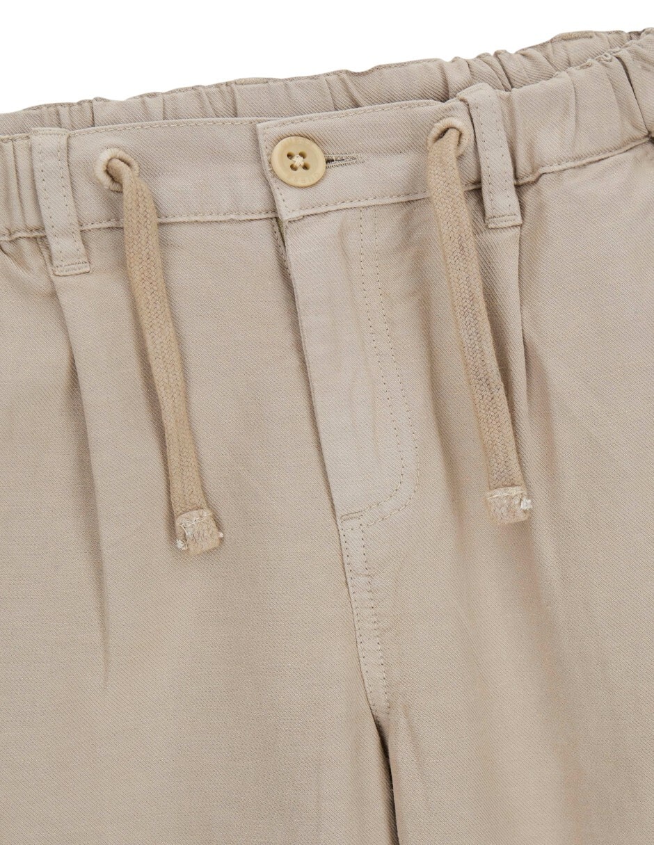 Jeans jogger relajado Guess lavado medio para niño